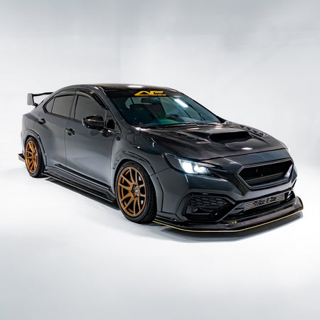 Black sports car with gold rims on a white background