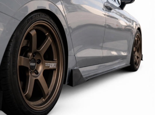 2021–2026 Kia K5 gloss black side skirt extensions installed with AFD aero kit